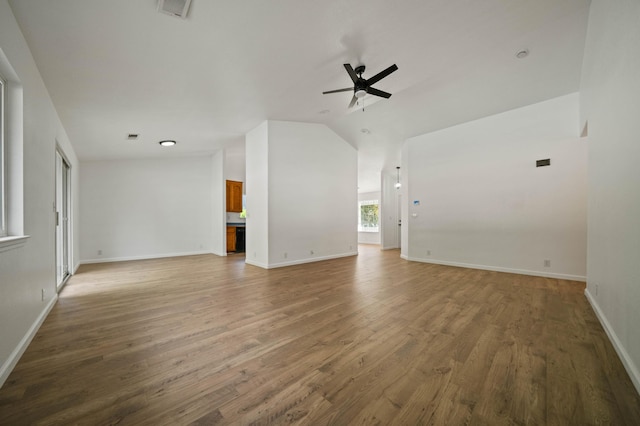 14556 Ryan Ln, Red Bluff, CA 96080 - unfurnished living room with a ceiling fan, visible vents, baseboards, lofted ceiling, and light wood-style floors
