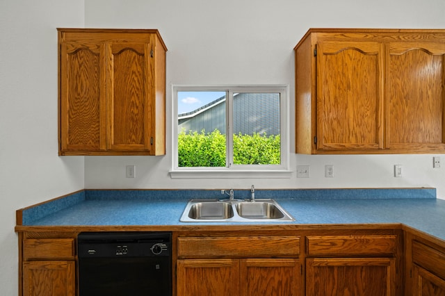 14556 Ryan Ln, Red Bluff, CA 96080 - kitchen featuring black dishwasher, dark countertops, brown cabinetry, and a sink