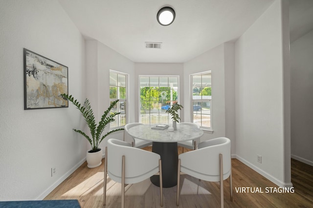 14556 Ryan Ln, Red Bluff, CA 96080 - dining area with baseboards, wood finished floors, and visible vents