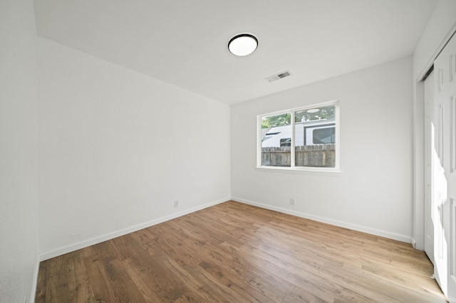 14556 Ryan Ln, Red Bluff, CA 96080 - unfurnished bedroom with baseboards, visible vents, wood finished floors, and a closet