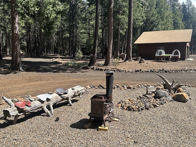view of yard with a wooded view