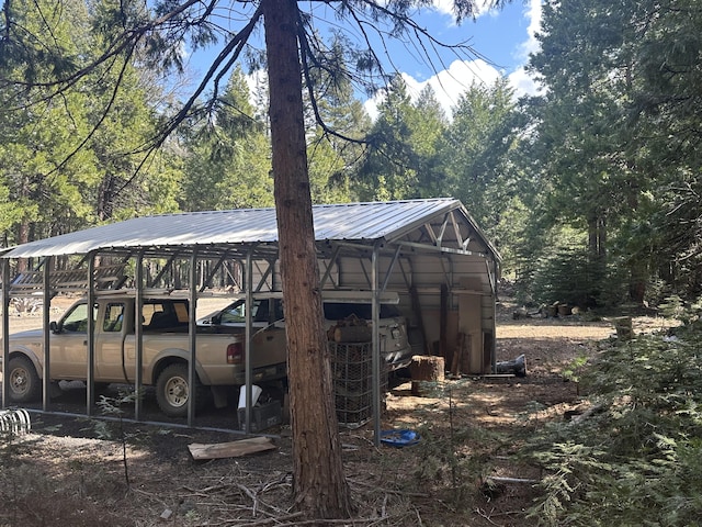 view of outbuilding with a carport