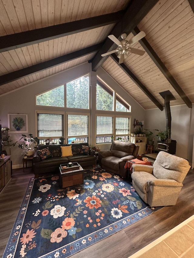 living area featuring vaulted ceiling with beams, a ceiling fan, wood finished floors, and wooden ceiling