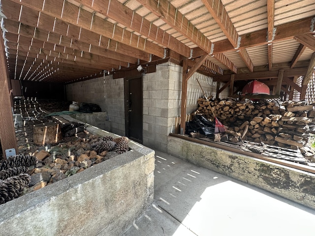 interior space with concrete block wall