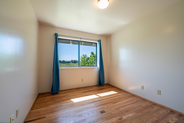 empty room featuring wood finished floors