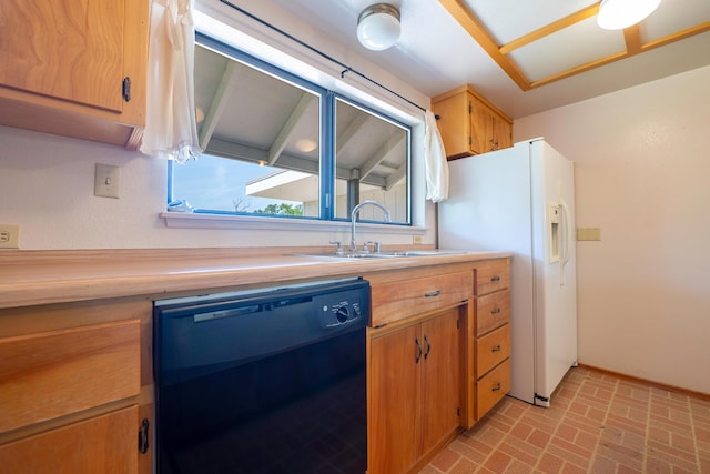 kitchen featuring white refrigerator with ice dispenser, brown cabinets, a sink, brick patterned floor, and black dishwasher