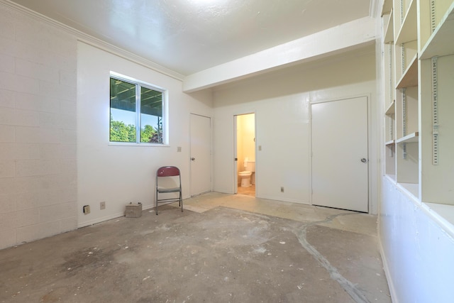 unfurnished room featuring crown molding