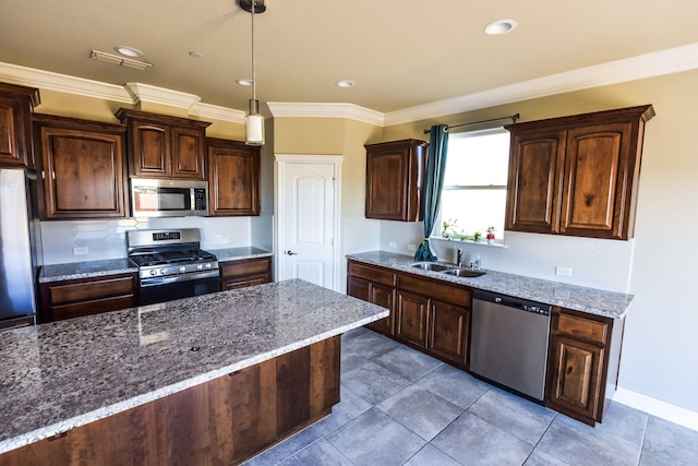 2876 Calaveras Ct, Redding, CA 96002 - kitchen with stainless steel appliances, a sink, light stone countertops, tasteful backsplash, and crown molding
