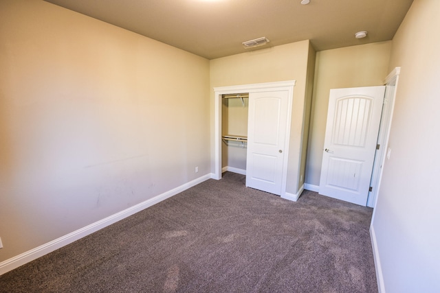 2876 Calaveras Ct, Redding, CA 96002 - unfurnished bedroom with dark carpet, baseboards, and a closet