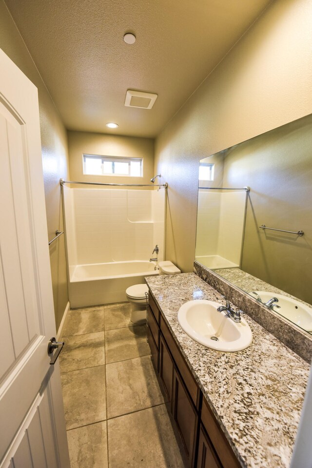 2876 Calaveras Ct, Redding, CA 96002 - full bathroom featuring vanity, toilet,  shower combination, a textured ceiling, and tile patterned floors
