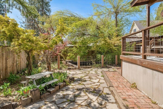 view of patio / terrace featuring fence