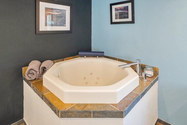 full bathroom with a whirlpool tub