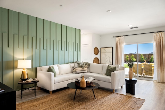 living room with visible vents and wood finished floors