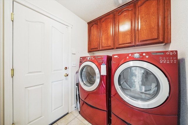 4217 Pendleton Ct, Shasta Lake, CA 96019 - laundry area featuring cabinet space, washer and dryer, light tile patterned floors, and a textured ceiling