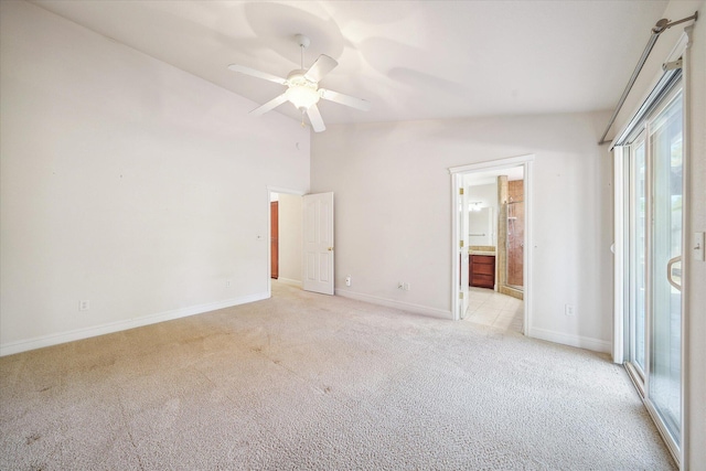 4217 Pendleton Ct, Shasta Lake, CA 96019 - unfurnished bedroom featuring light colored carpet, vaulted ceiling, baseboards, ensuite bathroom, and a ceiling fan