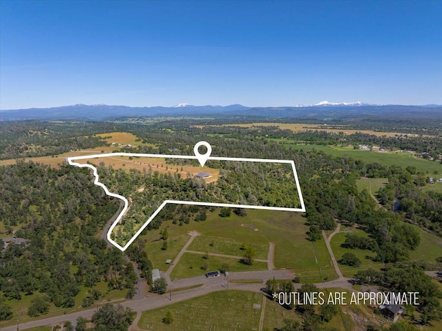 drone / aerial view featuring a mountain view
