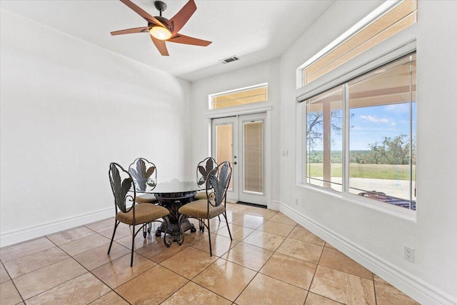 dining room with light tile patterned floors, french doors, visible vents, baseboards, and ceiling fan