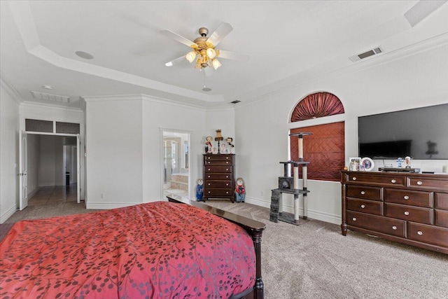 carpeted bedroom with crown molding, visible vents, baseboards, and a ceiling fan