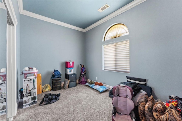 playroom with carpet flooring, visible vents, and ornamental molding