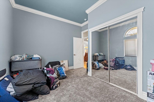 carpeted bedroom with a closet and ornamental molding