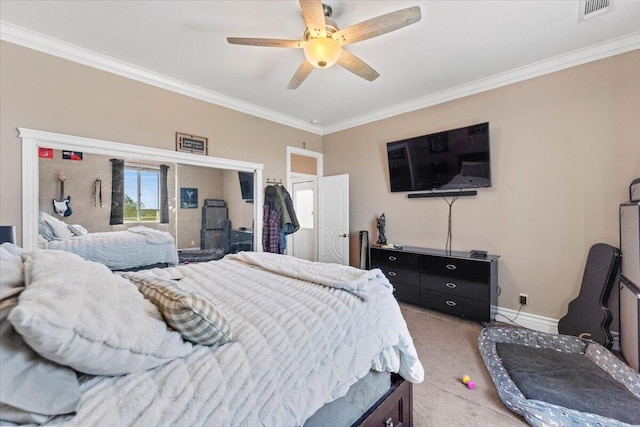 bedroom featuring a ceiling fan, visible vents, baseboards, light carpet, and ornamental molding