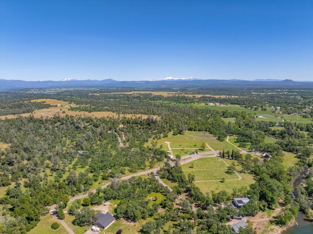 birds eye view of property featuring a mountain view