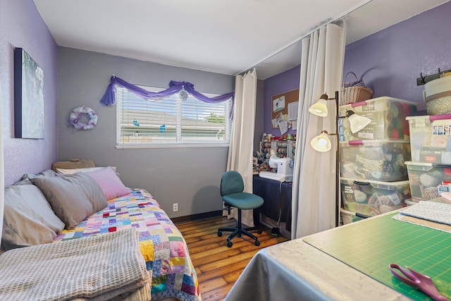 bedroom with wood finished floors