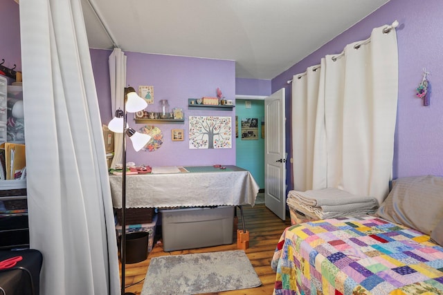 bedroom with wood finished floors