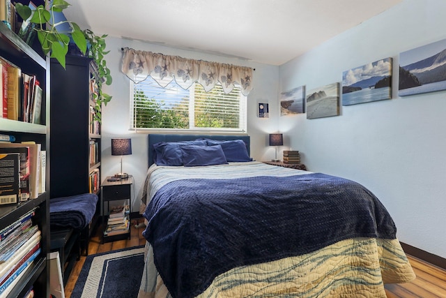 bedroom with wood finished floors