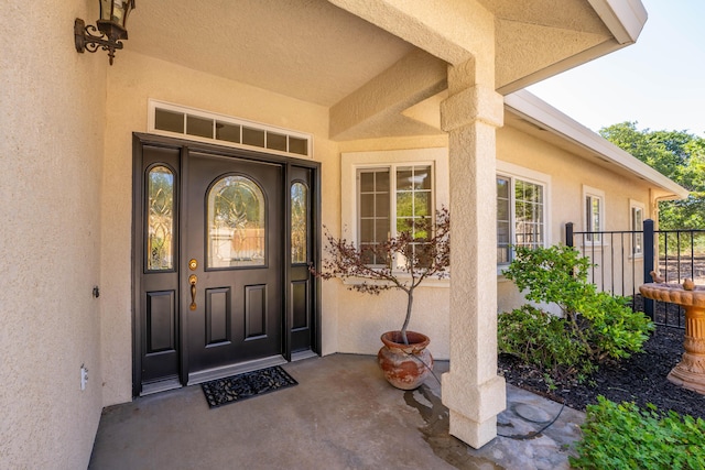 doorway to property with stucco siding