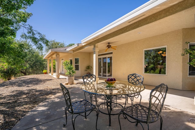view of patio / terrace featuring outdoor dining space and ceiling fan