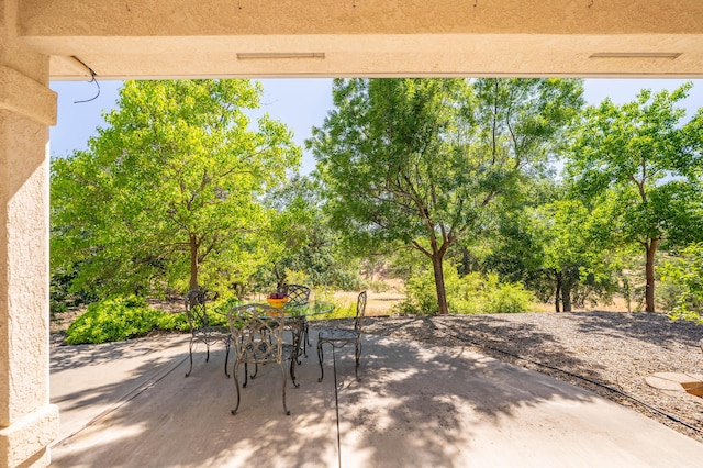 view of patio featuring outdoor dining area