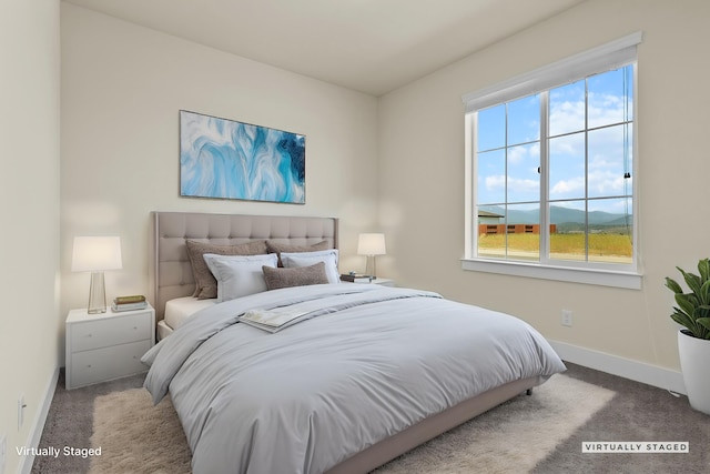 carpeted bedroom with baseboards