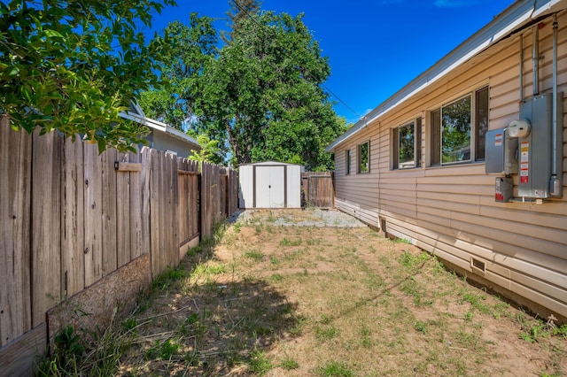 1530 Carmel Way, Red Bluff, CA 96080 - fenced backyard with a storage unit and an outdoor structure