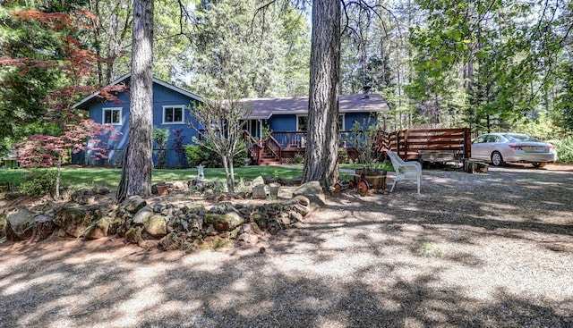 view of front of property with a deck and stairs