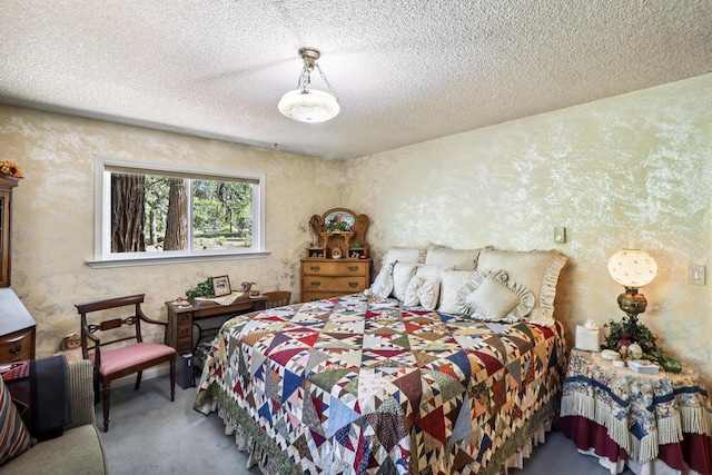 bedroom featuring carpet floors and a textured ceiling
