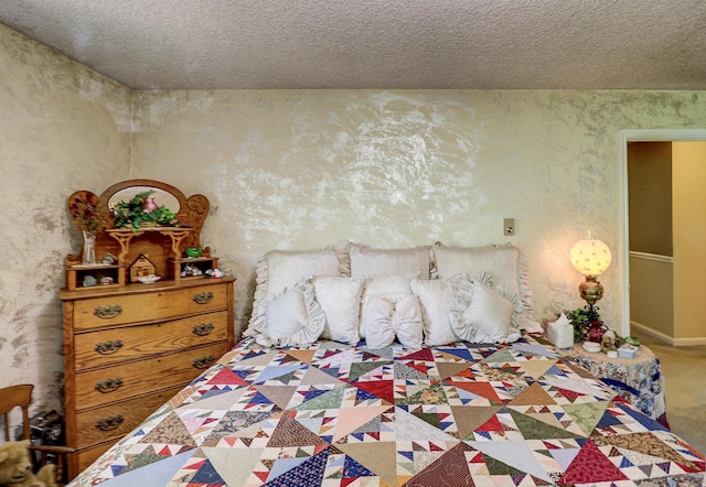 carpeted bedroom featuring a textured ceiling