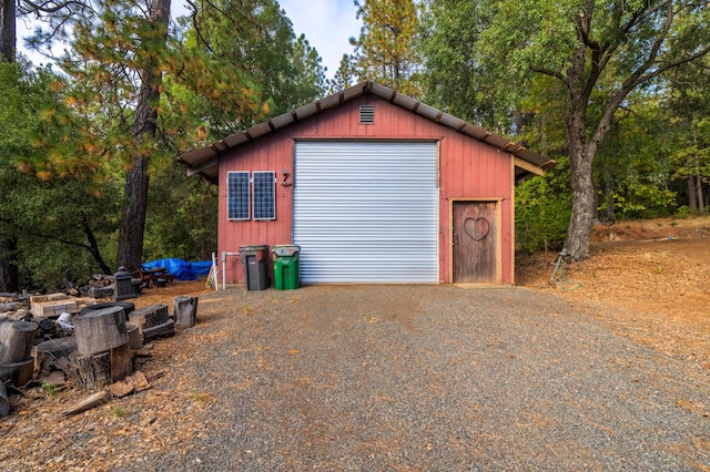 detached garage featuring driveway