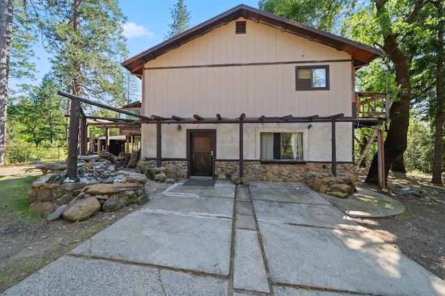 view of front of home featuring stone siding
