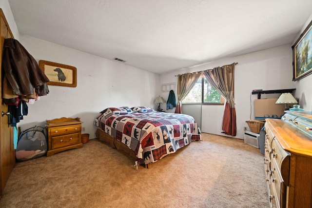 carpeted bedroom with visible vents