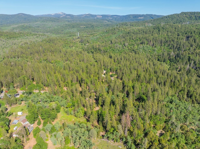 aerial view with a mountain view and a view of trees
