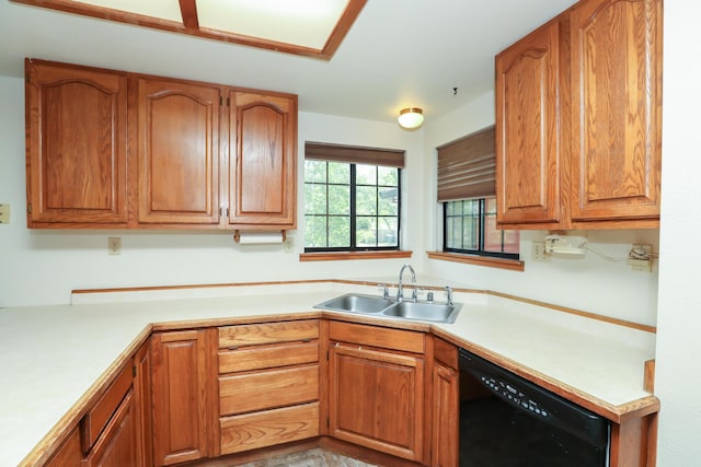 kitchen with dishwasher, a sink, light countertops, and brown cabinets