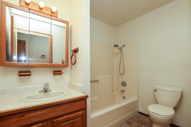 bathroom with toilet, vanity, and bathing tub / shower combination