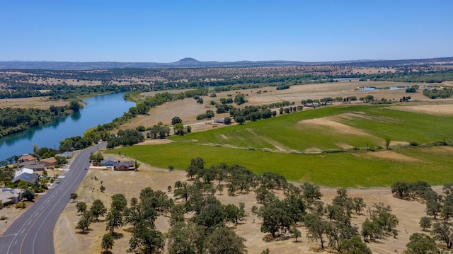 birds eye view of property with a water and mountain view and a rural view