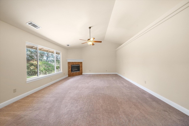 unfurnished living room featuring vaulted ceiling, ceiling fan, light carpet, and visible vents