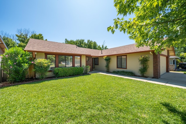 2529 Candlewood Dr, Redding, CA 96003 - ranch-style home with a garage, brick siding, a front lawn, and a shingled roof