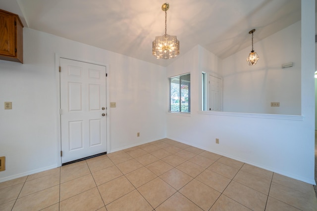 2529 Candlewood Dr, Redding, CA 96003 - unfurnished dining area with a chandelier, light tile patterned floors, and vaulted ceiling