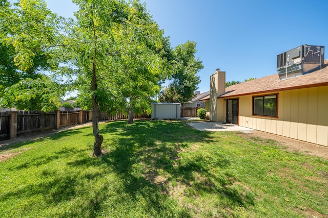 2529 Candlewood Dr, Redding, CA 96003 - fenced backyard featuring a storage unit and a patio