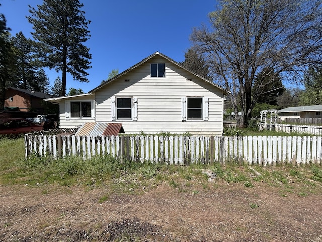 view of property exterior with fence
