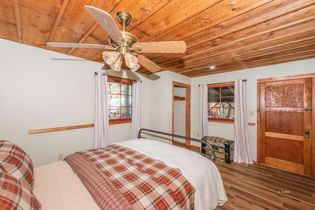 bedroom with wood ceiling, a ceiling fan, and wood finished floors
